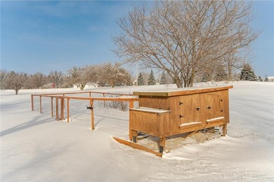 This 3-bed, 4-bath home on a full acre corner lot will not on Zumbro Valley Golf Club in Minnesota - for sale on GolfHomes.com, golf home, golf lot