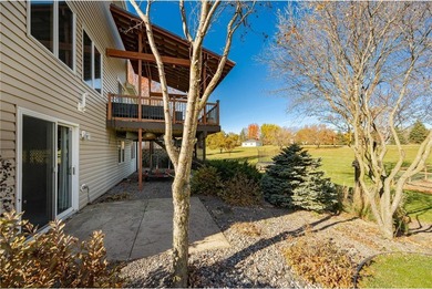 This 3-bed, 4-bath home on a full acre corner lot will not on Zumbro Valley Golf Club in Minnesota - for sale on GolfHomes.com, golf home, golf lot