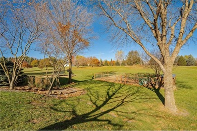This 3-bed, 4-bath home on a full acre corner lot will not on Zumbro Valley Golf Club in Minnesota - for sale on GolfHomes.com, golf home, golf lot
