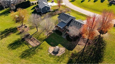 This 3-bed, 4-bath home on a full acre corner lot will not on Zumbro Valley Golf Club in Minnesota - for sale on GolfHomes.com, golf home, golf lot