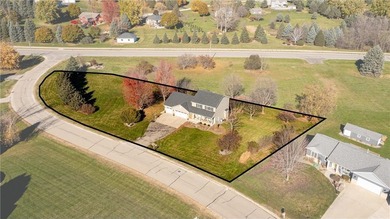 This 3-bed, 4-bath home on a full acre corner lot will not on Zumbro Valley Golf Club in Minnesota - for sale on GolfHomes.com, golf home, golf lot