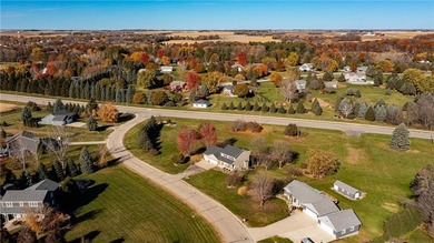 This 3-bed, 4-bath home on a full acre corner lot will not on Zumbro Valley Golf Club in Minnesota - for sale on GolfHomes.com, golf home, golf lot