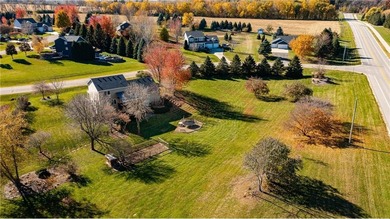 This 3-bed, 4-bath home on a full acre corner lot will not on Zumbro Valley Golf Club in Minnesota - for sale on GolfHomes.com, golf home, golf lot