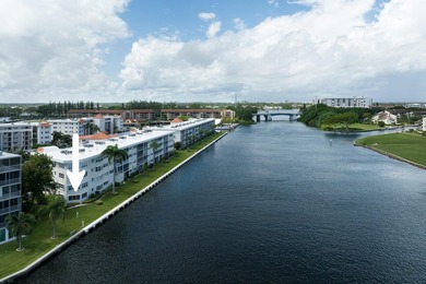 Enjoy the sweeping Intracoastal views in this first floor 2 on North Palm Beach Country Club in Florida - for sale on GolfHomes.com, golf home, golf lot