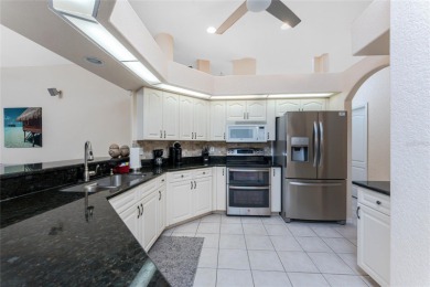 Enjoy serene waterfront living in this immaculate 3-bedroom, 2 on Pinemoor West Golf Club in Florida - for sale on GolfHomes.com, golf home, golf lot