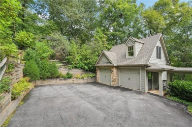 Nestled at the end of a quiet cul-de-sac, this five-bedroom on Big Canoe Golf Club - Cherokee in Georgia - for sale on GolfHomes.com, golf home, golf lot