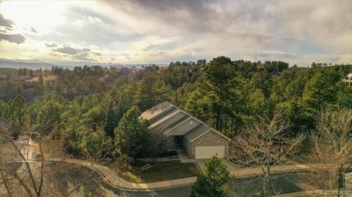 Exquisitely located on the edge of 11 acres of HOA owned forest on The Ridge At Castle Pines North in Colorado - for sale on GolfHomes.com, golf home, golf lot