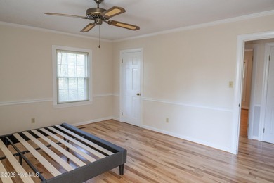 Discover a sanctuary of quiet elegance at 614 Lake Shore Drive on Walnut Creek Country Club in North Carolina - for sale on GolfHomes.com, golf home, golf lot