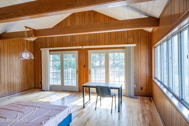 Discover a sanctuary of quiet elegance at 614 Lake Shore Drive on Walnut Creek Country Club in North Carolina - for sale on GolfHomes.com, golf home, golf lot