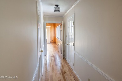 Discover a sanctuary of quiet elegance at 614 Lake Shore Drive on Walnut Creek Country Club in North Carolina - for sale on GolfHomes.com, golf home, golf lot