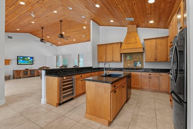 Experience timeless luxury and laid-back elegance on this gated on The Florida Club in Florida - for sale on GolfHomes.com, golf home, golf lot