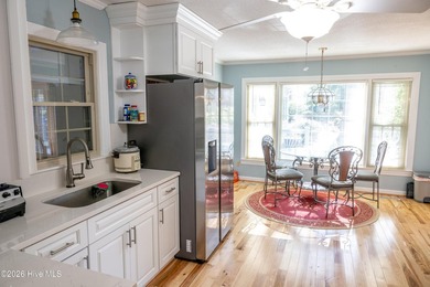 Discover a sanctuary of quiet elegance at 614 Lake Shore Drive on Walnut Creek Country Club in North Carolina - for sale on GolfHomes.com, golf home, golf lot