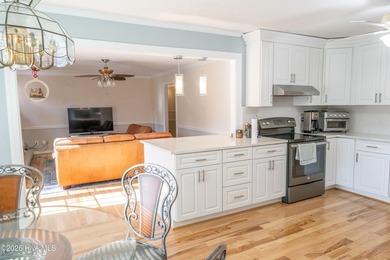 Discover a sanctuary of quiet elegance at 614 Lake Shore Drive on Walnut Creek Country Club in North Carolina - for sale on GolfHomes.com, golf home, golf lot