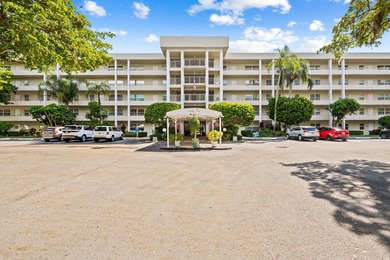 Discover your slice of paradise in this beautiful 2BR/2BA Palm on Palm-Aire Country Club and Resort - Palms in Florida - for sale on GolfHomes.com, golf home, golf lot