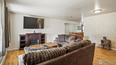 MAIN LEVEL LIVING WITH NEARBY AMENATIES, such as the local golf on Bunker Hill Country Club in Colorado - for sale on GolfHomes.com, golf home, golf lot