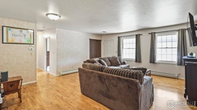 MAIN LEVEL LIVING WITH NEARBY AMENATIES, such as the local golf on Bunker Hill Country Club in Colorado - for sale on GolfHomes.com, golf home, golf lot