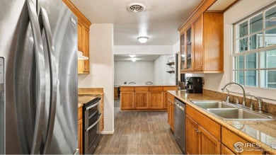 MAIN LEVEL LIVING WITH NEARBY AMENATIES, such as the local golf on Bunker Hill Country Club in Colorado - for sale on GolfHomes.com, golf home, golf lot