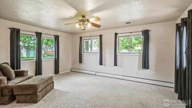 MAIN LEVEL LIVING WITH NEARBY AMENATIES, such as the local golf on Bunker Hill Country Club in Colorado - for sale on GolfHomes.com, golf home, golf lot