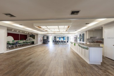 One or more photo(s) has been virtually staged. RARE, POND VILLA on Mainlands Golf Club in Florida - for sale on GolfHomes.com, golf home, golf lot