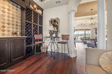 Welcome to 568 Luna Bella Lane, a luxurious lakefront estate on Venetian Bay Golf Course in Florida - for sale on GolfHomes.com, golf home, golf lot