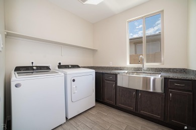Experience luxury desert living in this stunning 4-bedroom on Las Barrancas Golf Course in Arizona - for sale on GolfHomes.com, golf home, golf lot