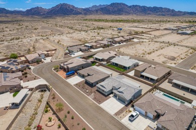 Experience luxury desert living in this stunning 4-bedroom on Las Barrancas Golf Course in Arizona - for sale on GolfHomes.com, golf home, golf lot