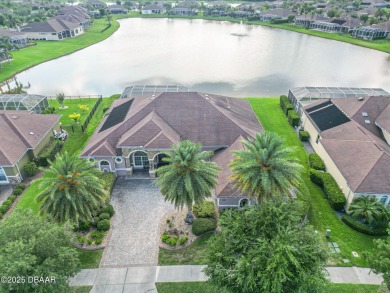 Welcome to 568 Luna Bella Lane, a luxurious lakefront estate on Venetian Bay Golf Course in Florida - for sale on GolfHomes.com, golf home, golf lot