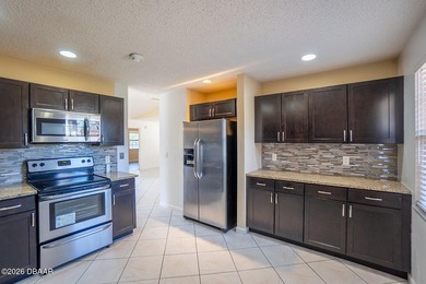 Spacious open plan and ready to move in home. This home is much on The Grand Club - Pine Lakes Course in Florida - for sale on GolfHomes.com, golf home, golf lot