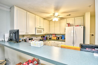 Top Floor End Unit Condo in Crow Creek, Calabash, NC. Enjoy on Crow Creek Golf Club in North Carolina - for sale on GolfHomes.com, golf home, golf lot