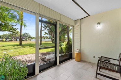 Completely remodeled in 2023, this 2-bedroom, 2.5-bath lakefront on Palm-Aire Country Club and Resort - Palms in Florida - for sale on GolfHomes.com, golf home, golf lot