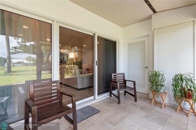 Completely remodeled in 2023, this 2-bedroom, 2.5-bath lakefront on Palm-Aire Country Club and Resort - Palms in Florida - for sale on GolfHomes.com, golf home, golf lot