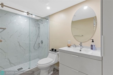 Completely remodeled in 2023, this 2-bedroom, 2.5-bath lakefront on Palm-Aire Country Club and Resort - Palms in Florida - for sale on GolfHomes.com, golf home, golf lot