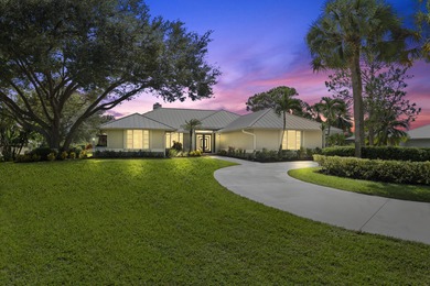 Discover this absolute showstopper! Nestled on a full 1-acre lot on Evergreen Club in Florida - for sale on GolfHomes.com, golf home, golf lot