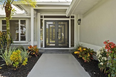 Discover this absolute showstopper! Nestled on a full 1-acre lot on Evergreen Club in Florida - for sale on GolfHomes.com, golf home, golf lot