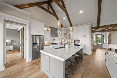 Welcome to this exceptional reverse 1.5-story walkout home in on Fred Arbanas Golf Course At Longview Lakes - Longview Lake in Missouri - for sale on GolfHomes.com, golf home, golf lot