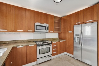 MOTIVATED SELLER!! Rare Bayfront Townhome with 30ft Boat Dock in on Normandy Shores Golf Course in Florida - for sale on GolfHomes.com, golf home, golf lot