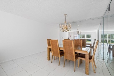 Best priced unit with impact windows! Stunning waterfront 2 on Wynmoor Golf Course in Florida - for sale on GolfHomes.com, golf home, golf lot