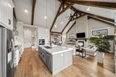 Welcome to this exceptional reverse 1.5-story walkout home in on Fred Arbanas Golf Course At Longview Lakes - Longview Lake in Missouri - for sale on GolfHomes.com, golf home, golf lot
