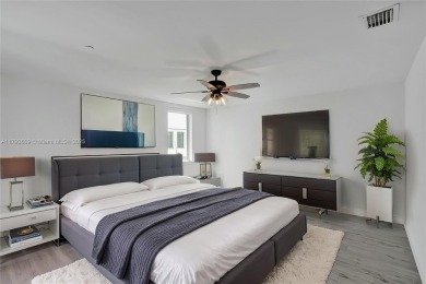 MOTIVATED SELLER!! Rare Bayfront Townhome with 30ft Boat Dock in on Normandy Shores Golf Course in Florida - for sale on GolfHomes.com, golf home, golf lot