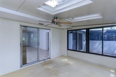 Tucked beneath the shade of moss-draped oaks and overlooking on Tarpon Woods Golf Club in Florida - for sale on GolfHomes.com, golf home, golf lot
