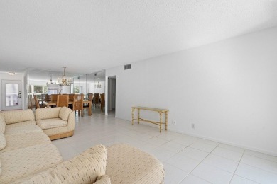 Best priced unit with impact windows! Stunning waterfront 2 on Wynmoor Golf Course in Florida - for sale on GolfHomes.com, golf home, golf lot