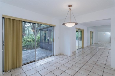 Tucked beneath the shade of moss-draped oaks and overlooking on Tarpon Woods Golf Club in Florida - for sale on GolfHomes.com, golf home, golf lot