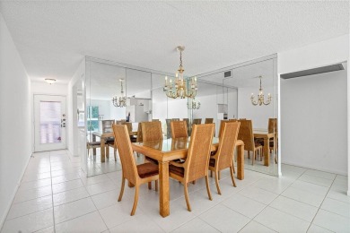 Best priced unit with impact windows! Stunning waterfront 2 on Wynmoor Golf Course in Florida - for sale on GolfHomes.com, golf home, golf lot