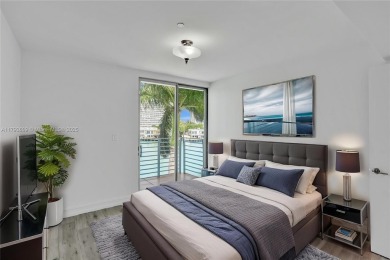 MOTIVATED SELLER!! Rare Bayfront Townhome with 30ft Boat Dock in on Normandy Shores Golf Course in Florida - for sale on GolfHomes.com, golf home, golf lot