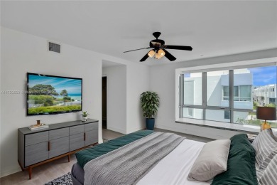 MOTIVATED SELLER!! Rare Bayfront Townhome with 30ft Boat Dock in on Normandy Shores Golf Course in Florida - for sale on GolfHomes.com, golf home, golf lot