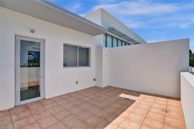 MOTIVATED SELLER!! Rare Bayfront Townhome with 30ft Boat Dock in on Normandy Shores Golf Course in Florida - for sale on GolfHomes.com, golf home, golf lot