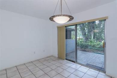 Tucked beneath the shade of moss-draped oaks and overlooking on Tarpon Woods Golf Club in Florida - for sale on GolfHomes.com, golf home, golf lot