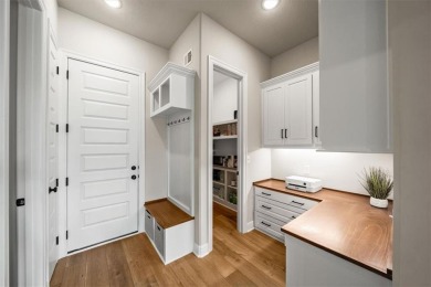 Welcome to this exceptional reverse 1.5-story walkout home in on Fred Arbanas Golf Course At Longview Lakes - Longview Lake in Missouri - for sale on GolfHomes.com, golf home, golf lot