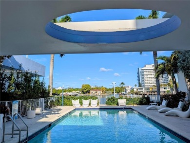 MOTIVATED SELLER!! Rare Bayfront Townhome with 30ft Boat Dock in on Normandy Shores Golf Course in Florida - for sale on GolfHomes.com, golf home, golf lot
