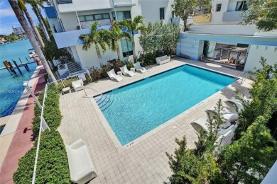 MOTIVATED SELLER!! Rare Bayfront Townhome with 30ft Boat Dock in on Normandy Shores Golf Course in Florida - for sale on GolfHomes.com, golf home, golf lot